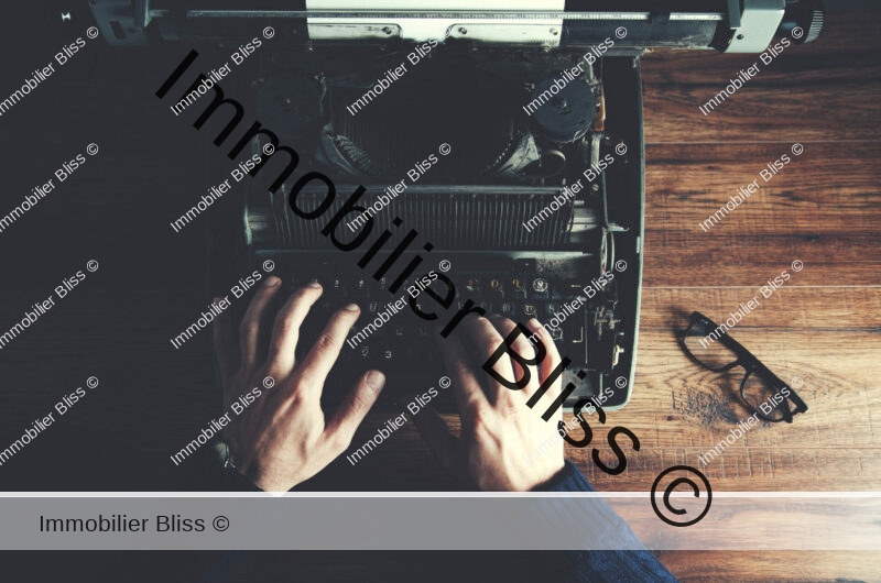 Typewriter with man hand on table