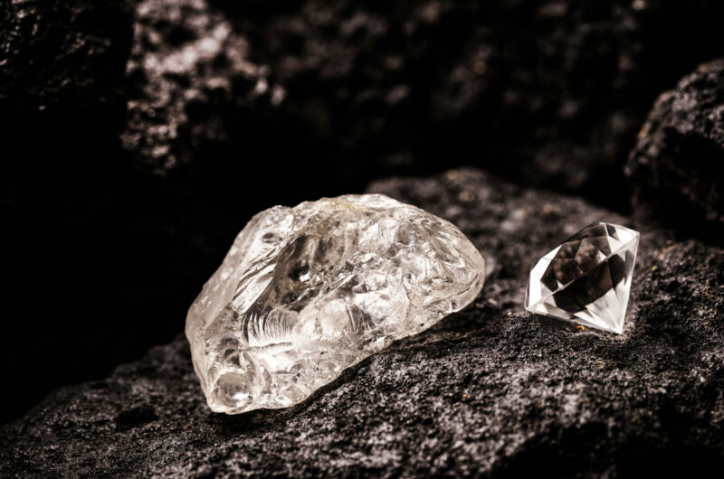 rough diamond and cut diamond in coal mine, mining concept and rare gemstone